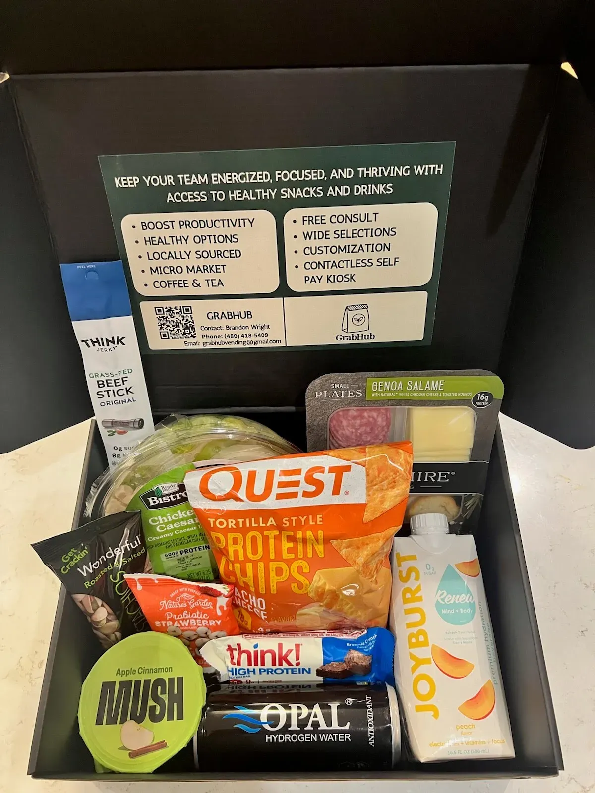 Grab Hub Vending free sample snack box delivered during a complimentary break room assessment—assorted healthy snacks and drinks.